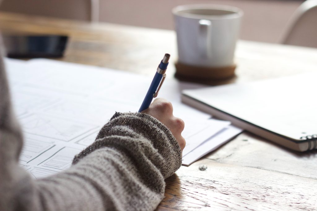 Case Study writing with pen